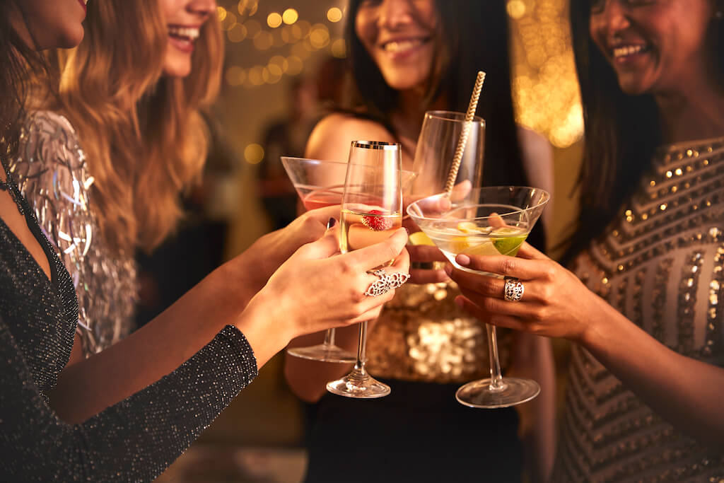 Female Friends Make Toast As They Celebrate At Party